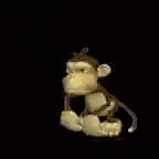 a stuffed monkey is waving and holding a gun in its hand .