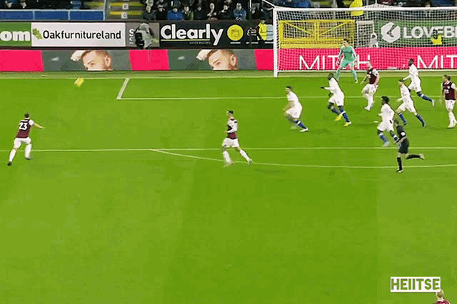a soccer game is being played in front of a clearly sign