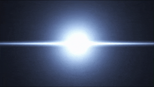 a bright light is shining on a dark background .