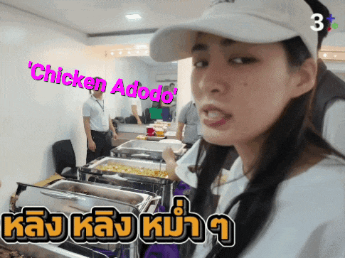 a woman in a white hat stands in front of a buffet line that says ' chicken adobo ' on the top