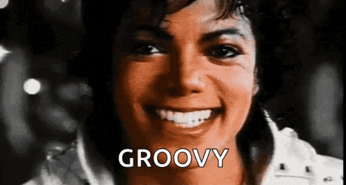 a close up of a woman 's face with the word groovy written on it .