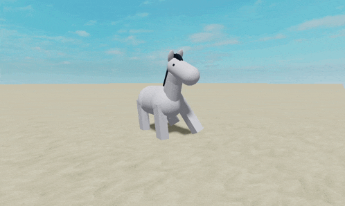 a white horse with a black mane and tail standing in the sand