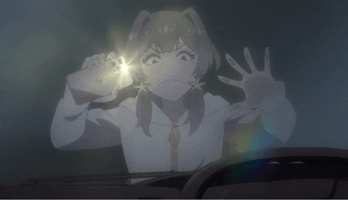 a girl in a white shirt is holding a flashlight and making a face