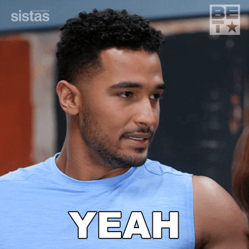 a man in a blue tank top says yeah in white letters