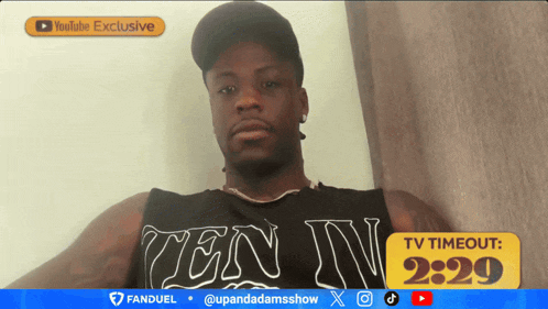 a man wearing a tank top that says ten iv on it