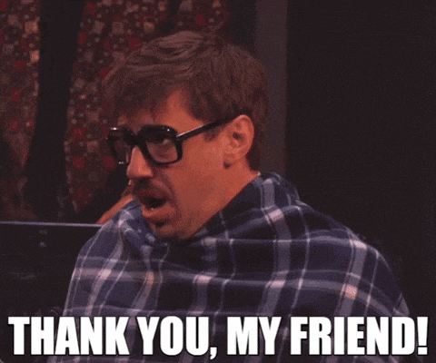 a man wearing glasses and a plaid shirt is saying thank you my friend