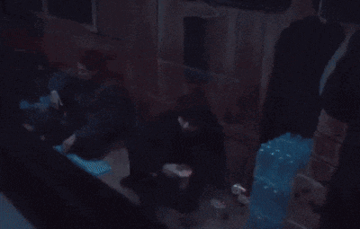 a blurry picture of a man holding a gun