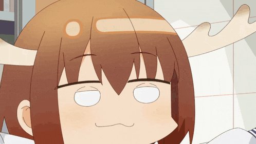a cartoon character with horns on her head making a face