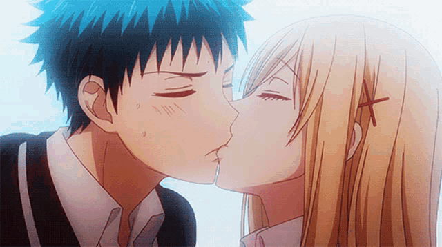 a boy and a girl kissing with a cross on their head