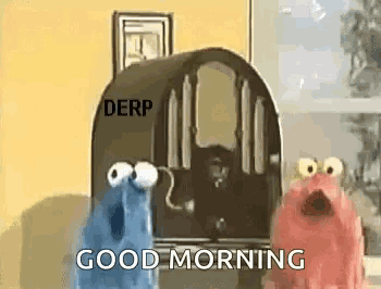 a couple of sesame street characters are standing in front of a radio and saying `` good morning '' .