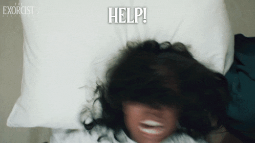 a poster for the exorcist shows a woman laying on a pillow with her mouth open