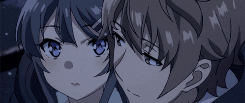 a boy and a girl are looking at each other and the girl has blue eyes