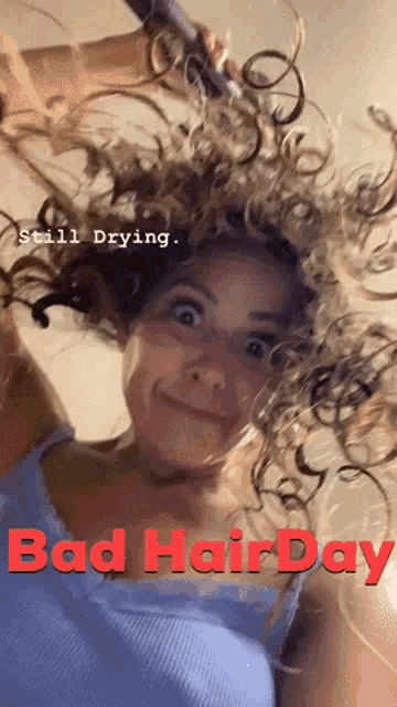 a picture of a woman with curly hair and the words bad hair day
