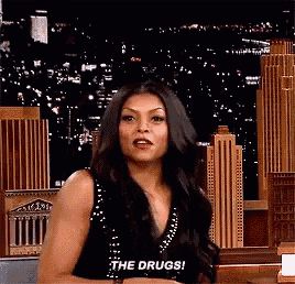 a woman is saying the drugs in front of a city skyline .