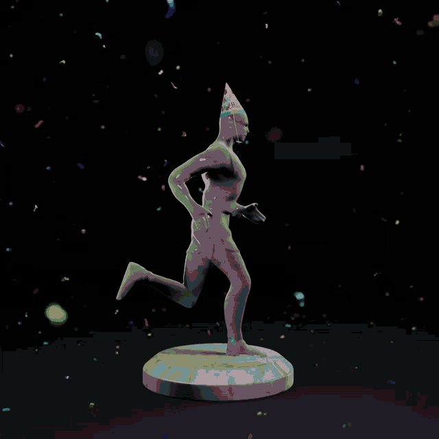 a statue of a man wearing a party hat surrounded by confetti