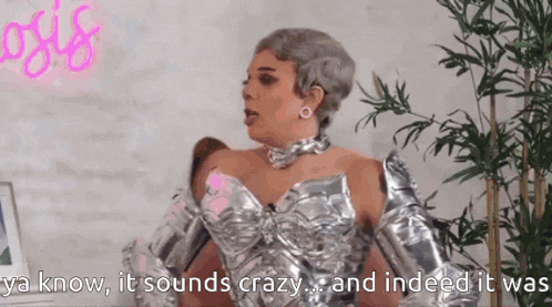 a woman in a silver dress says " ya know , it sounds crazy and indeed it was "
