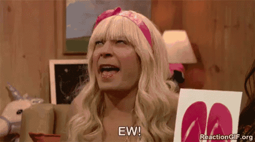 a man in a blonde wig is sitting on a couch holding a picture of flip flops .