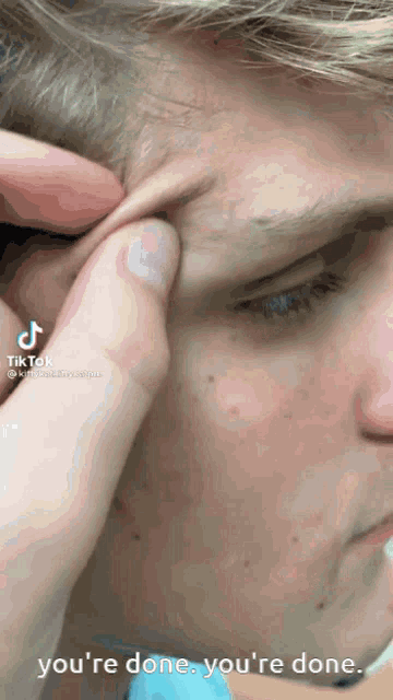 a close up of a man 's face with the words " you 're done you 're done " next to him
