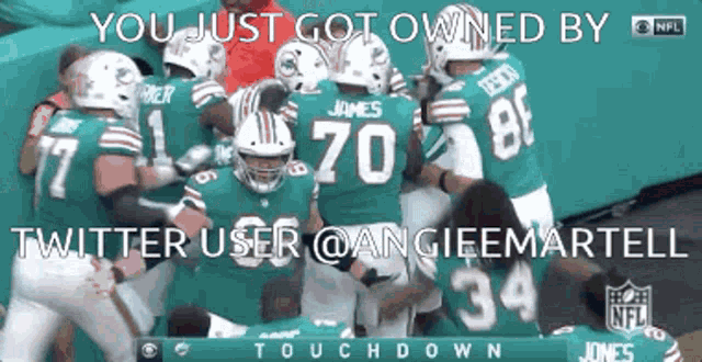 a football player with the number 70 on his back is surrounded by other players