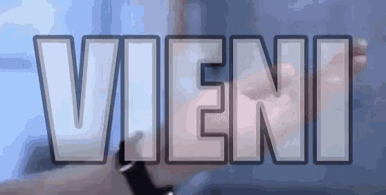 a close up of a person 's hand with the word vieni in the background