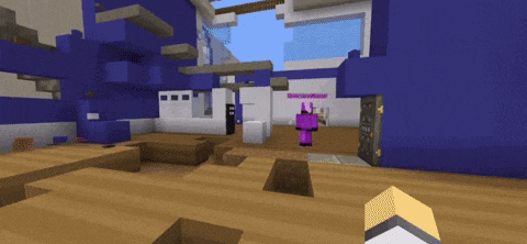 a person in a pink outfit is standing in front of a purple building in a video game called minecraft