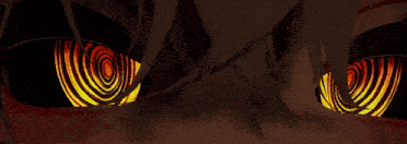 a close up of a person 's eyes that are glowing in the dark .