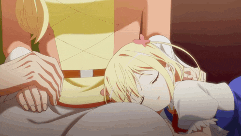 a little girl with blonde hair is sleeping on a bed