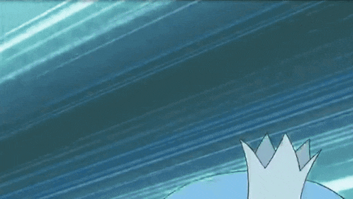 a blue cartoon character with a white crown on its head is making a funny face .