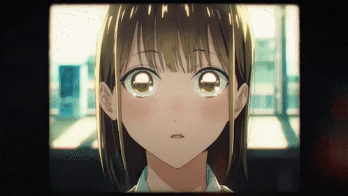 a close up of a girl 's face with a tear in her eye