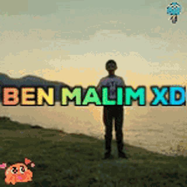ben malim xd is standing on the shore of a body of water .