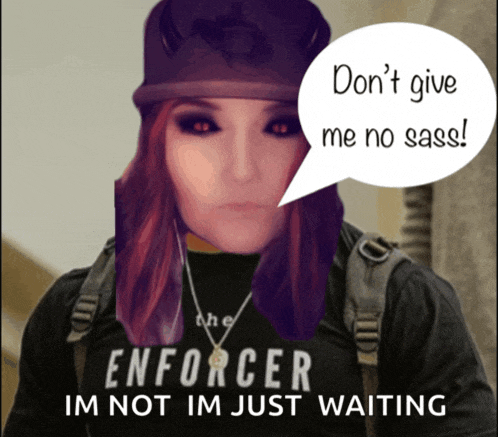 a woman wearing a black shirt that says ' enforcer im not im just waiting '