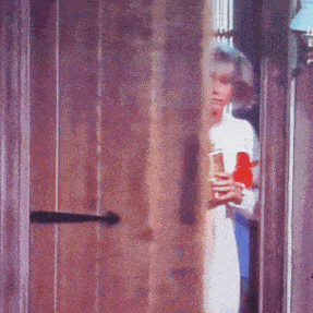 a woman in a white dress is holding a red bottle
