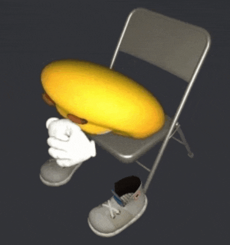 a yellow smiley face is sitting on a chair