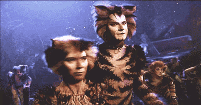 a pixelated image of two cats standing next to each other