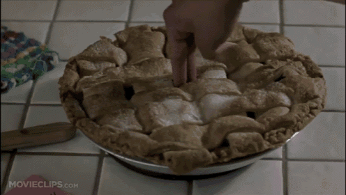 a pie with movieclips.com written on the bottom of it