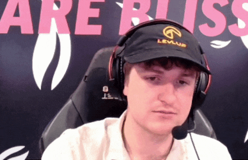 a man wearing headphones and a hat that says levius on it