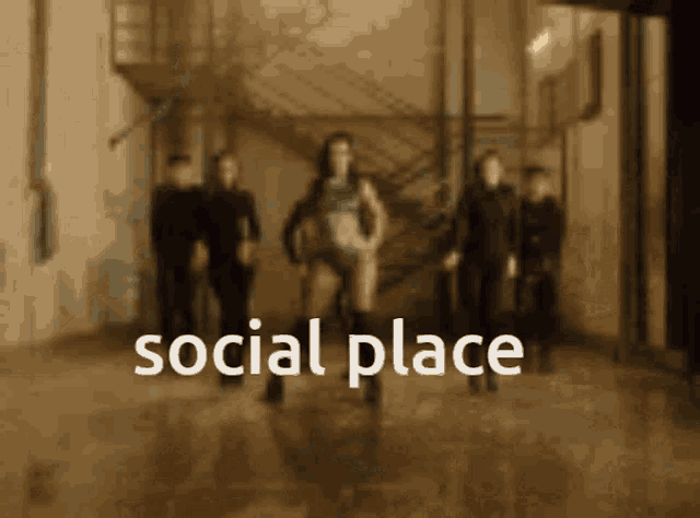 a group of people are standing in a room with the words social place written on the bottom