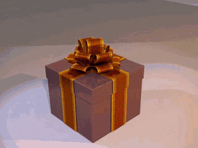 a purple gift box with a gold striped bow