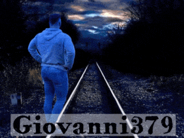 a man standing on train tracks with the name giovanni379 written on the bottom