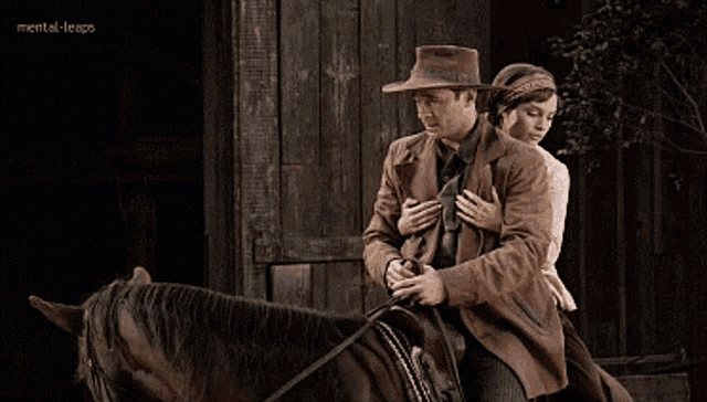 a man in a hat is riding a horse with a woman behind him and the words mental-leaps visible in the corner