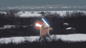 a polar bear is holding a lightsaber in a snowy field