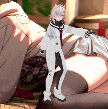 a girl in a white and black outfit is standing in front of a blanket