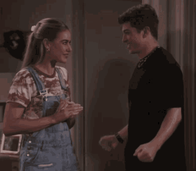 a man and a woman standing next to each other