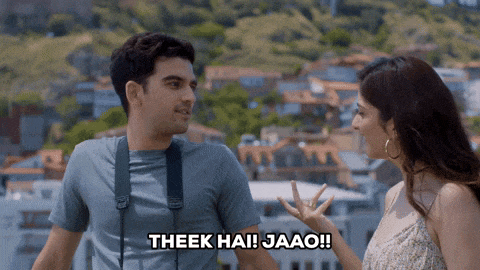 a man talking to a woman with the words " theek hai jaao " on the bottom