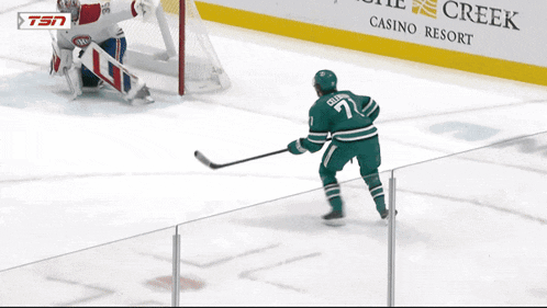 a hockey game is being played in front of an advertisement for the habbas law