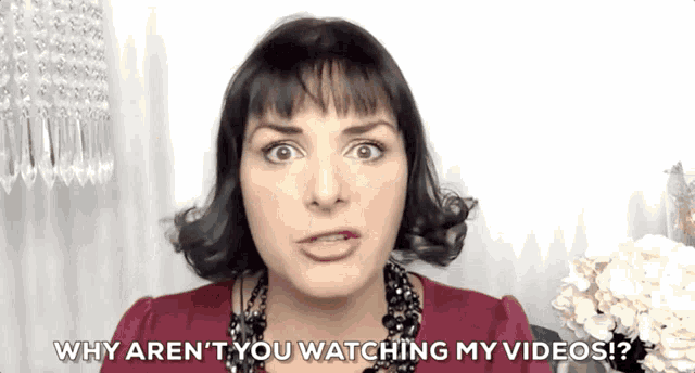 a woman is asking why aren 't you watching her videos