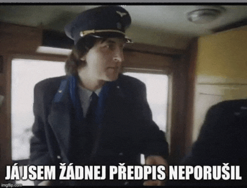 a man in a military uniform stands in front of a sign that says " jajsem zadnej predpis neporusil "