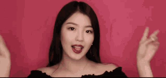 a young woman with red lipstick is making a funny face .