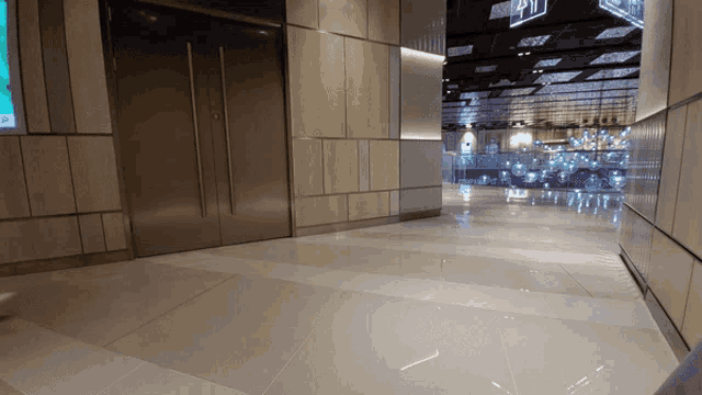a hallway with a sign that says exit