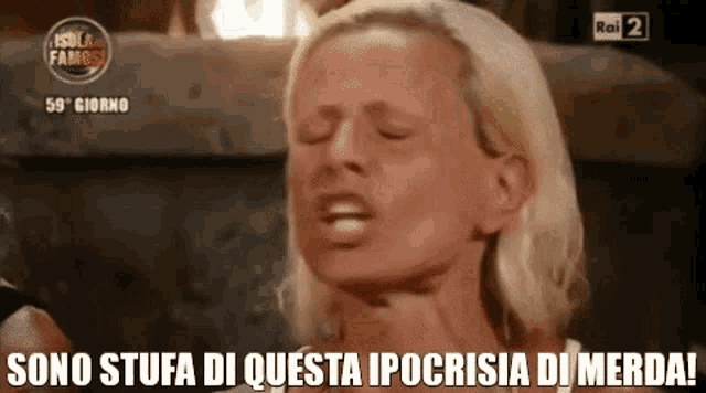 a woman is making a funny face with the words sono stufa di questa ipocrisia di merda written below her